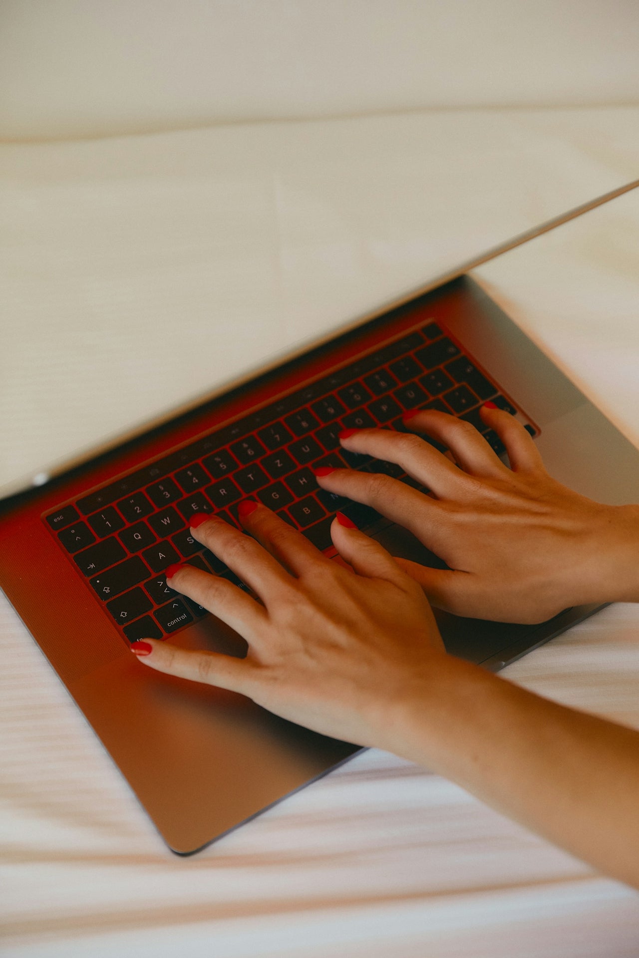 Typing on laptop