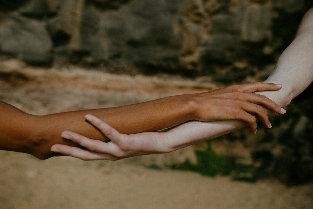 Hands reaching together, a study in connection and craft