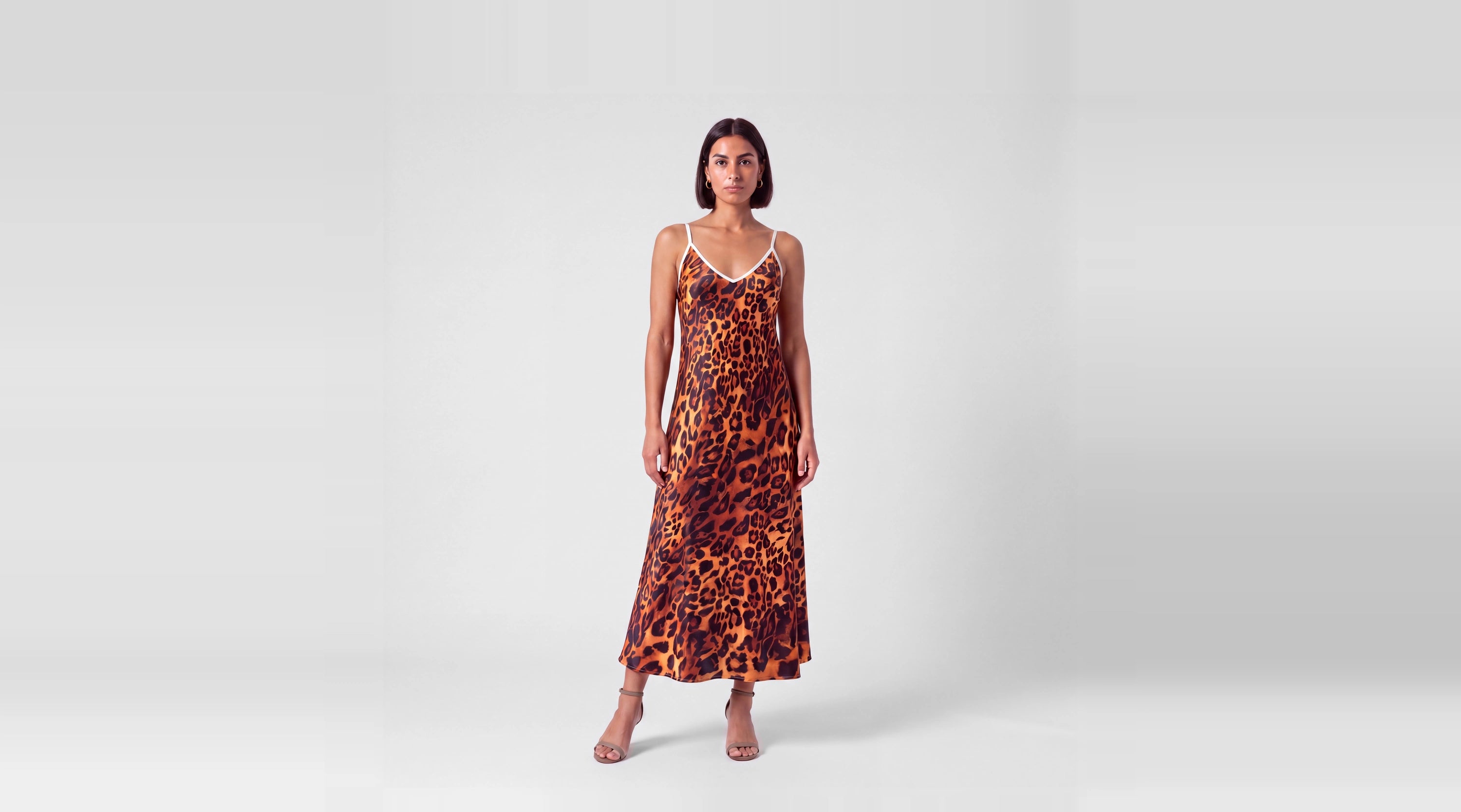 Fauve de Soie silk slip dress in amber and black leopard, front view
