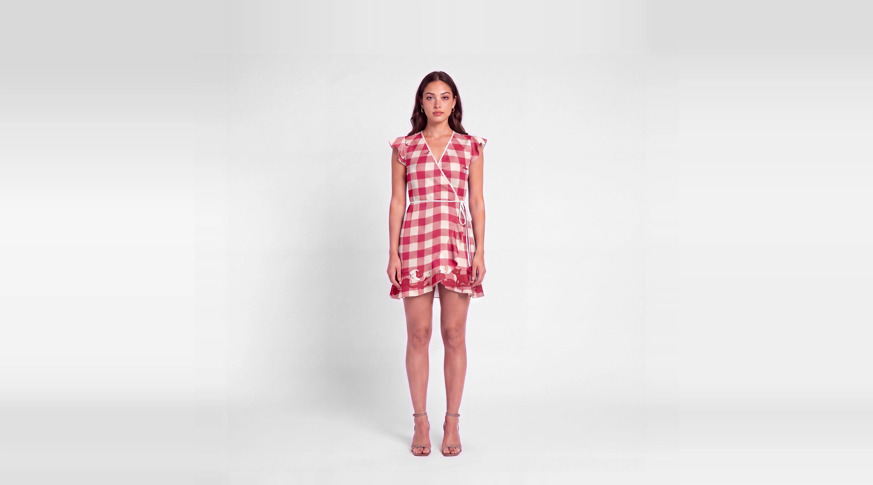 Promenade Rouge silk-body wrap tea dress in red and ivory gingham with illustrated hem motifs, front view