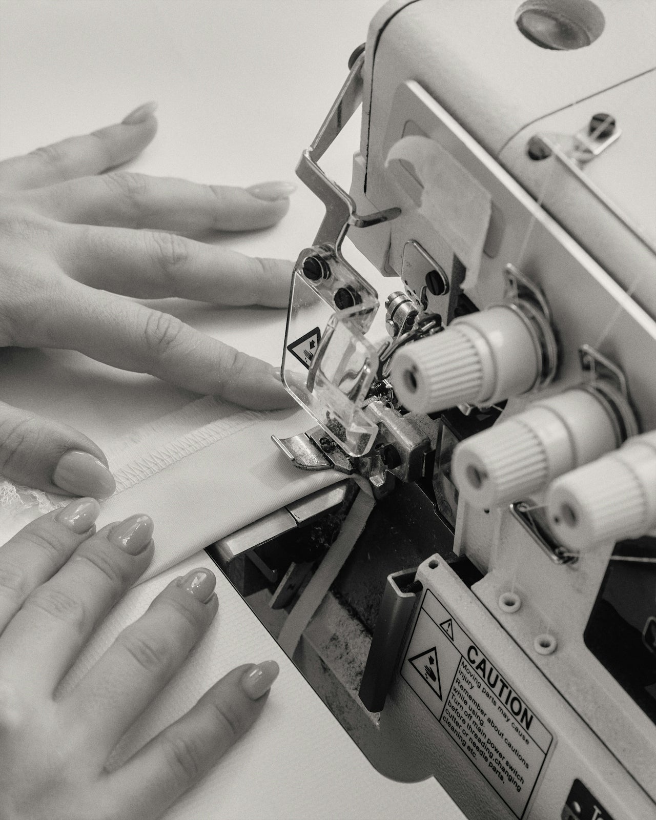 Artisan at sewing machine