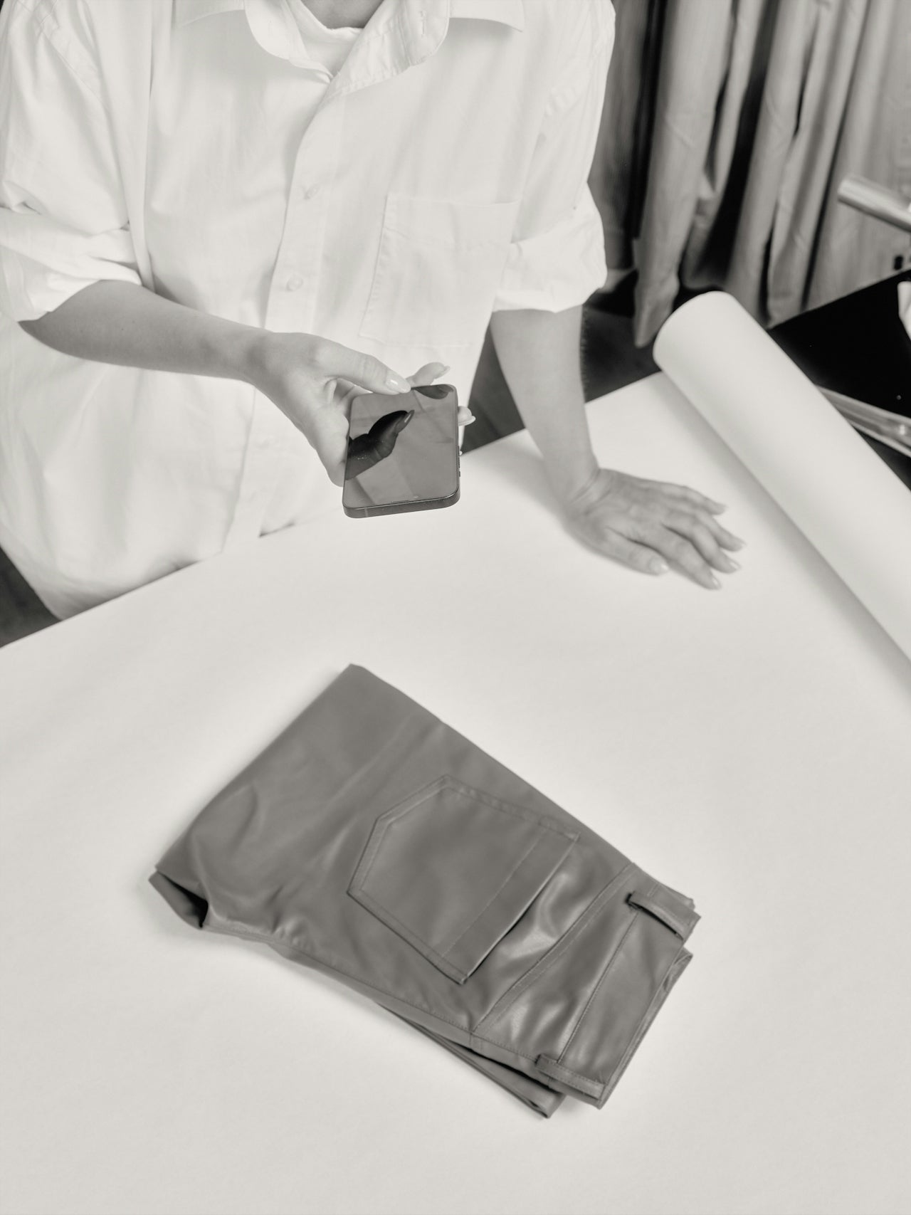 Artisan inspecting garment