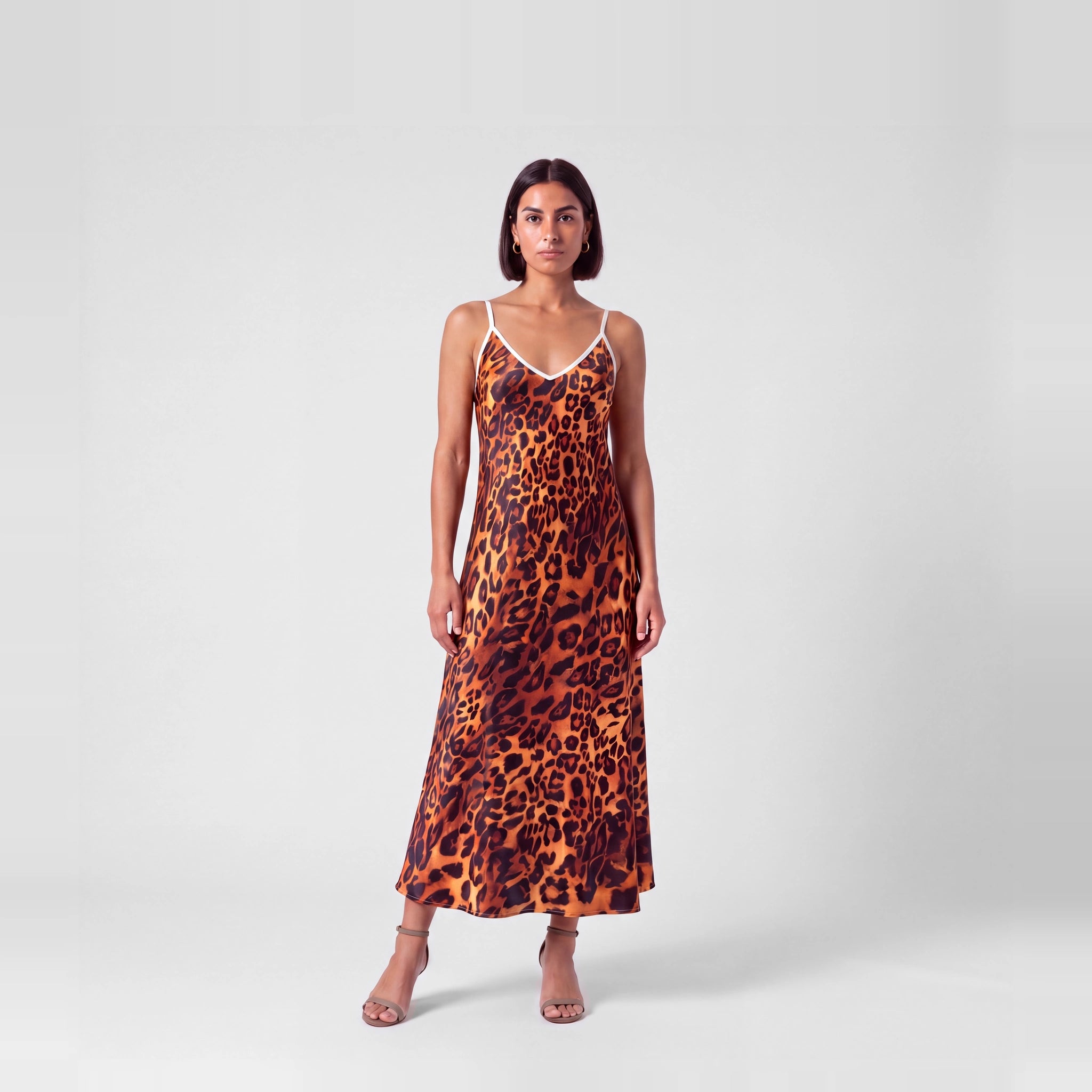 Fauve de Soie silk slip dress in amber and black leopard, front view